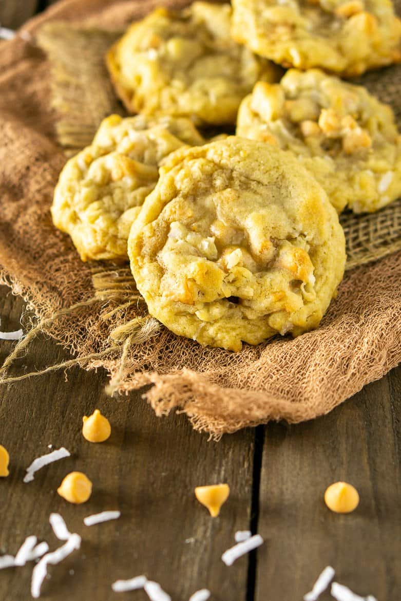 A pile of butterscotch-coconut-bourbon cookies on burlap.