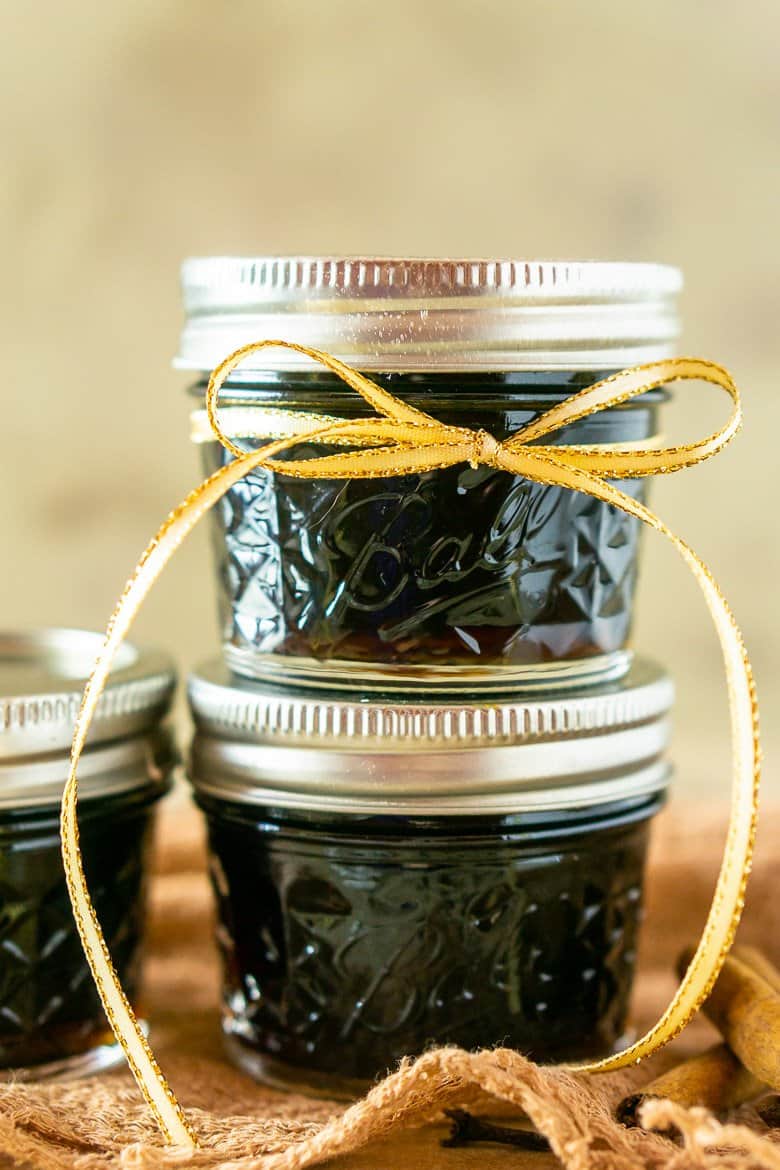 Two jars of simple syrup stacked on top of each other