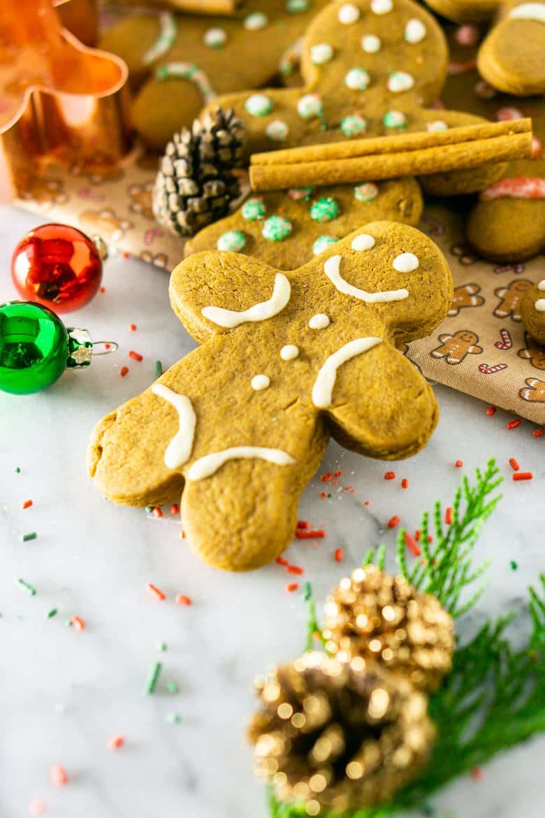 A gingerbread man cookie with Christmas decorations.