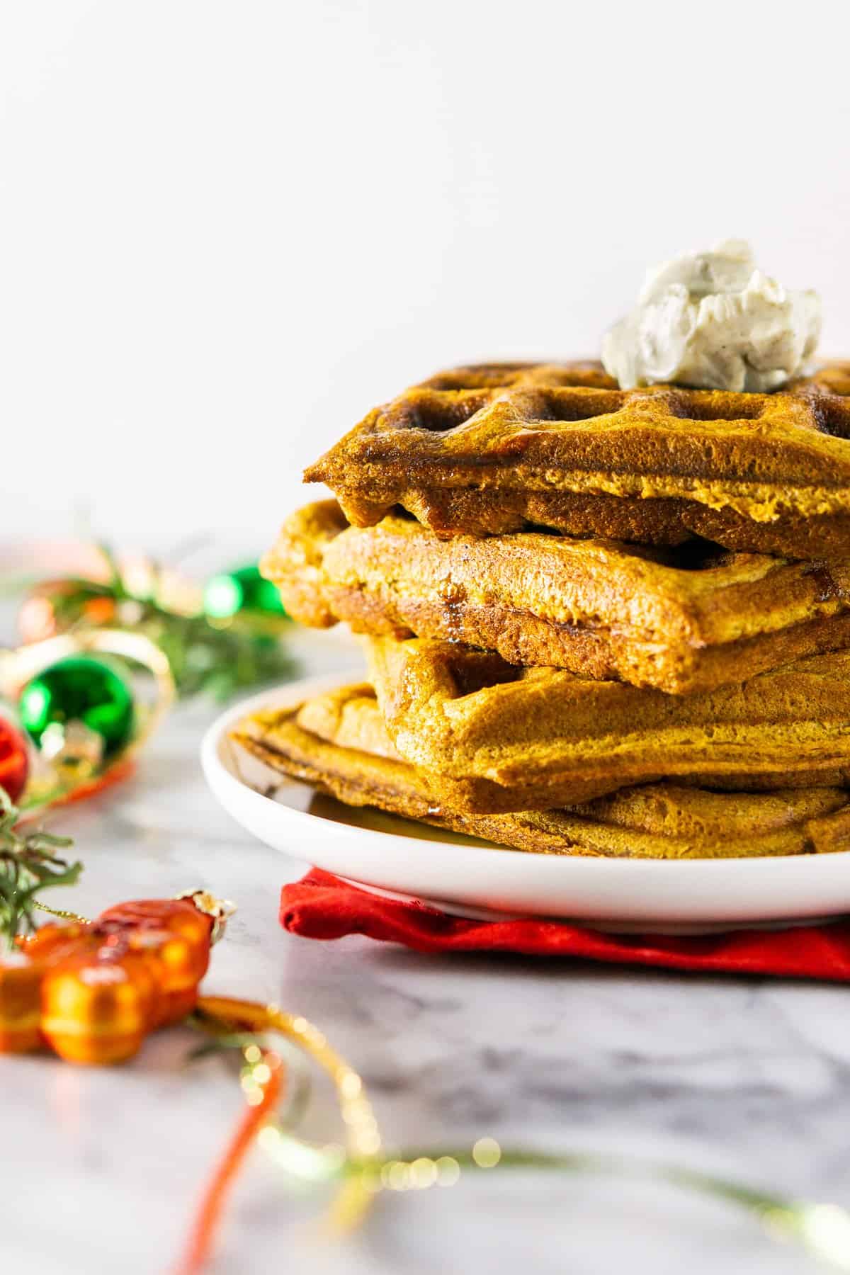 A side view of a stack of gingerbread waffles.