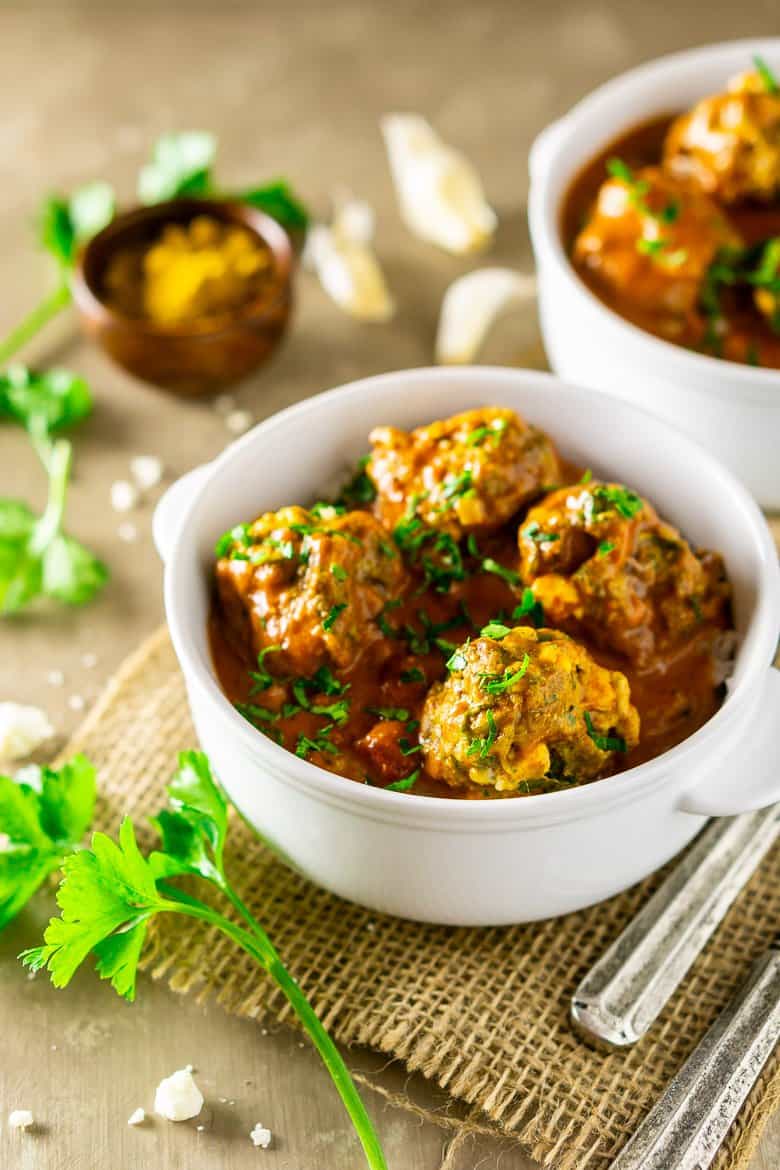 Two bowls of curried feta-lamb meatballs.