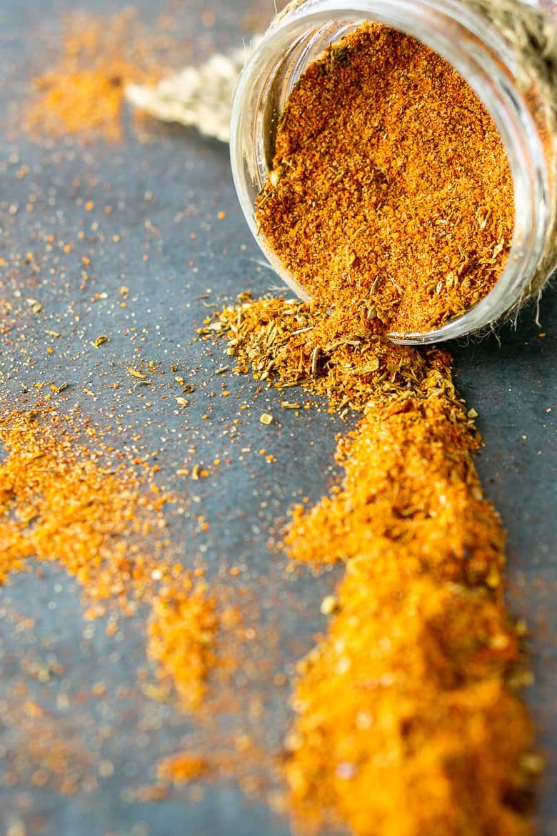 A turned-over jar of homemade Cajun seasoning.