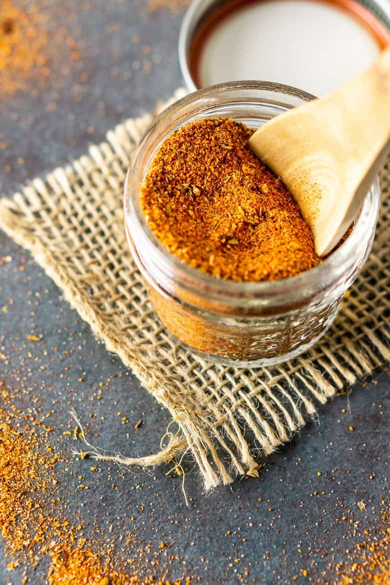 An aerial shot of a jar of homemade Cajun seasoning.