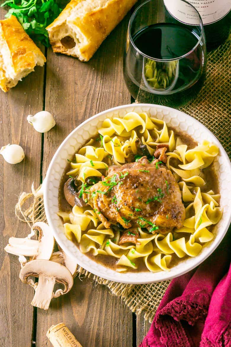 An aerial shot of the coq au vin with wine.