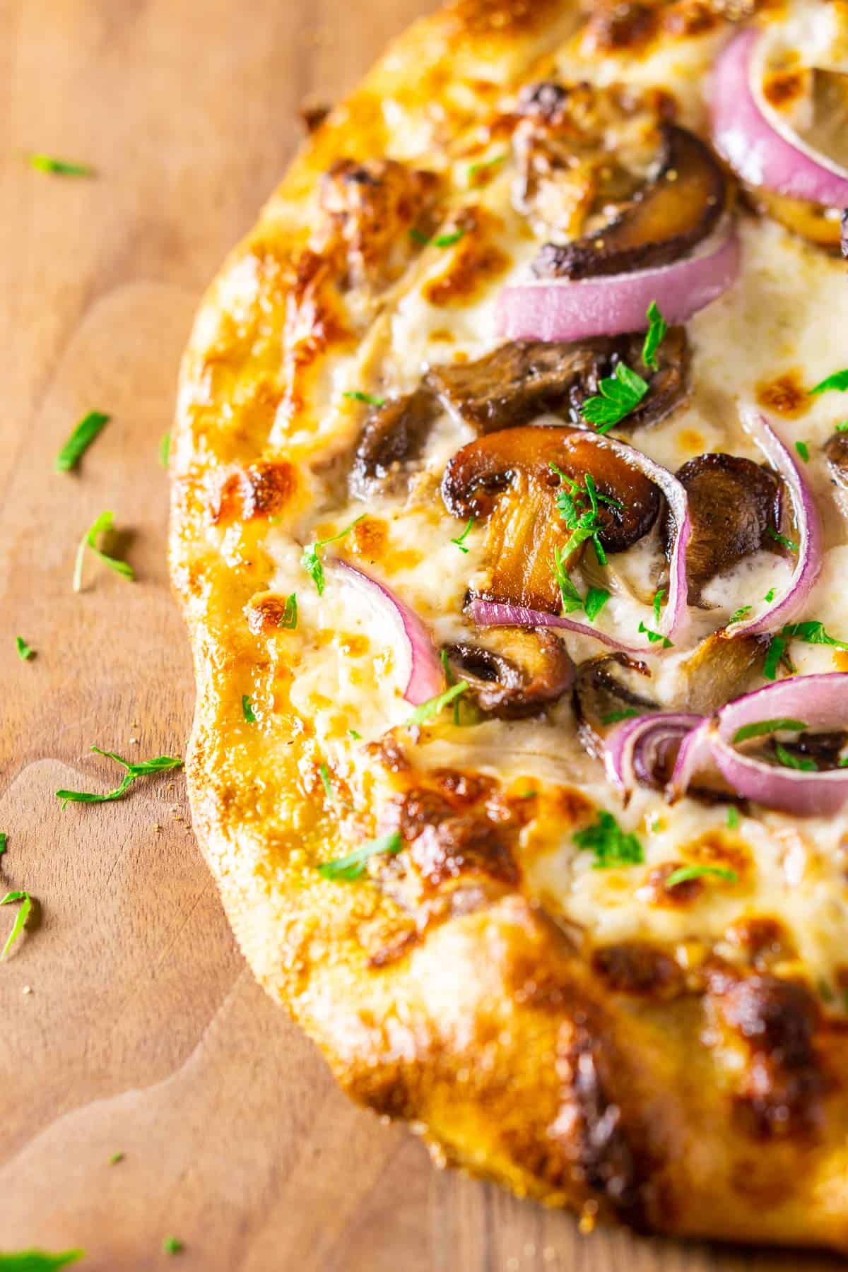 The finished make-ahead beer pizza dough with mushrooms, chicken, red onion and parsley.