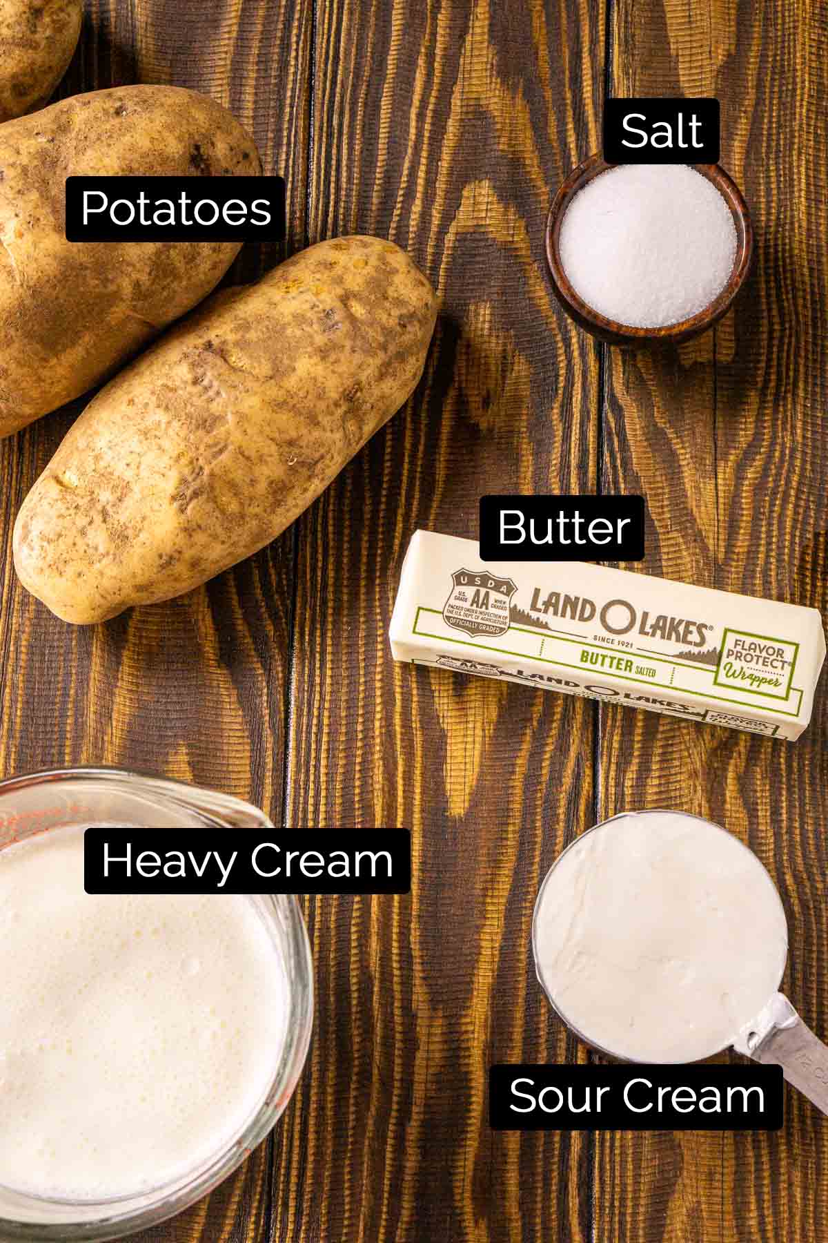 The brown butter mashed potato ingredients with labels on a wooden board.
