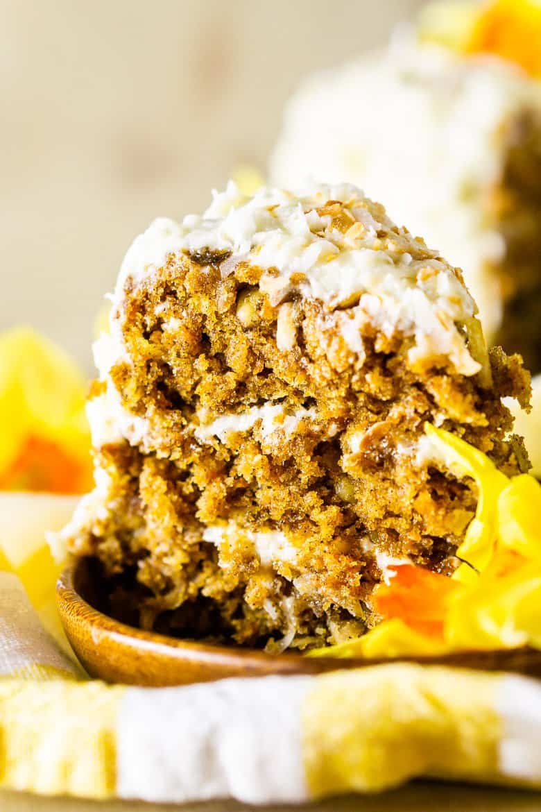 A closeup of the homemade carrot cake with coconut cream cheese frosting.