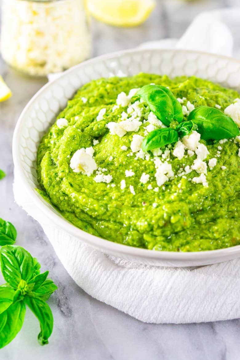 A bowl of avocado pesto blended smooth.