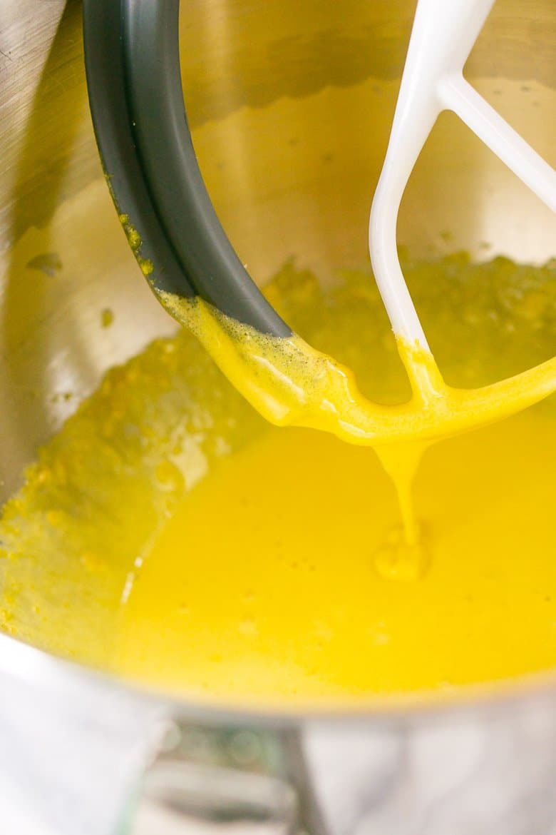 The beaten egg yolks streaming down in a ribbon.