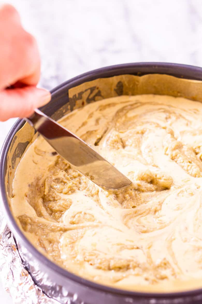 Swirling the cheesecake mixture and bananas foster curd.