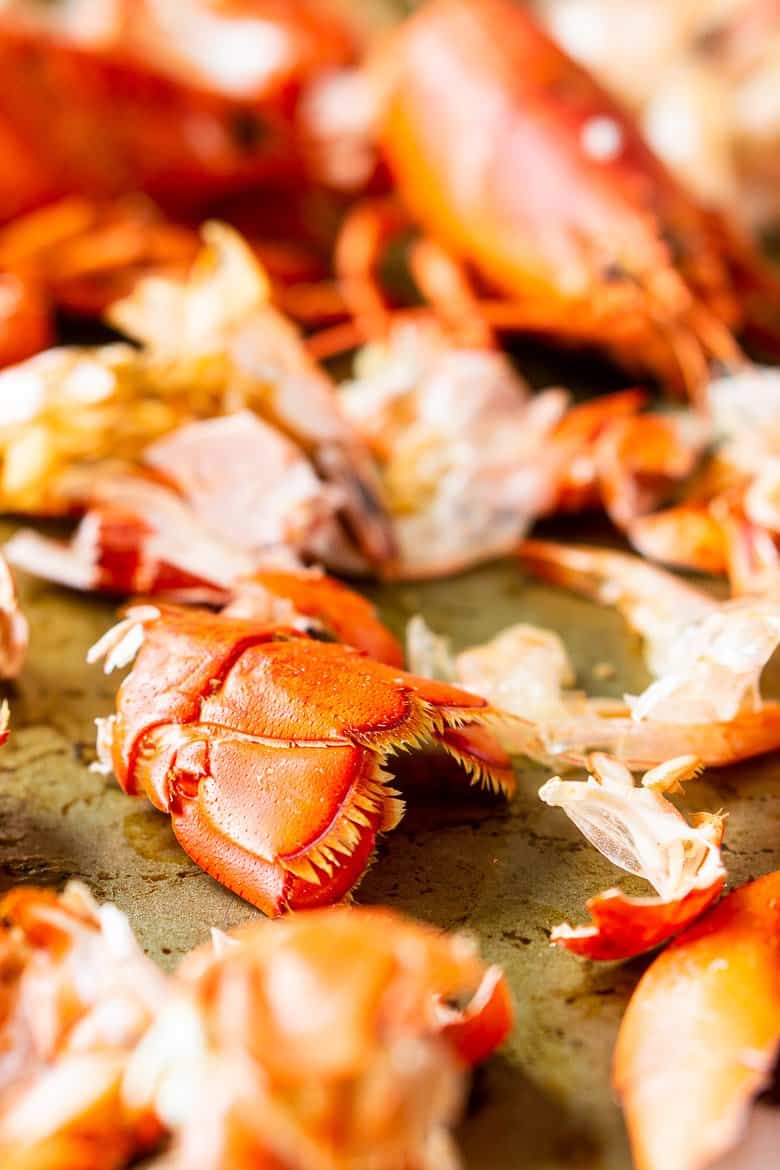 A large sheet pan with sea fish shells to roast for the homemade seafood stock.