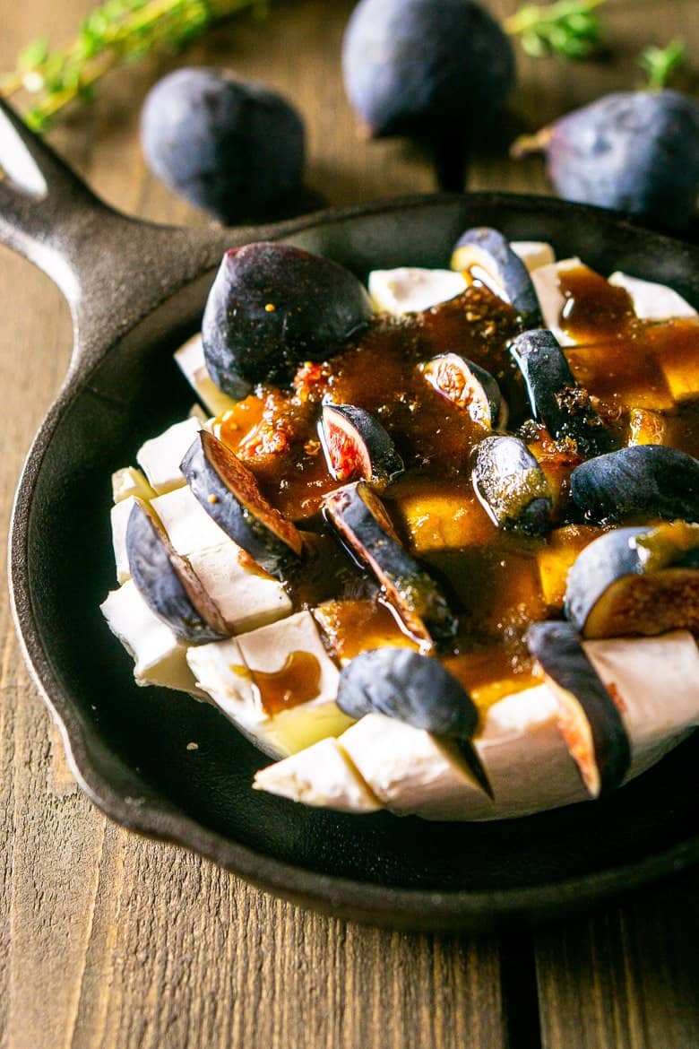 Brie cut into cubes with slices of figs and the Kahlua sauce poured on top.