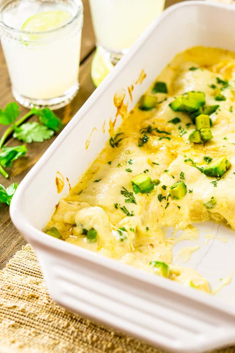 A pan of jerk chicken enchiladas that has already been served.