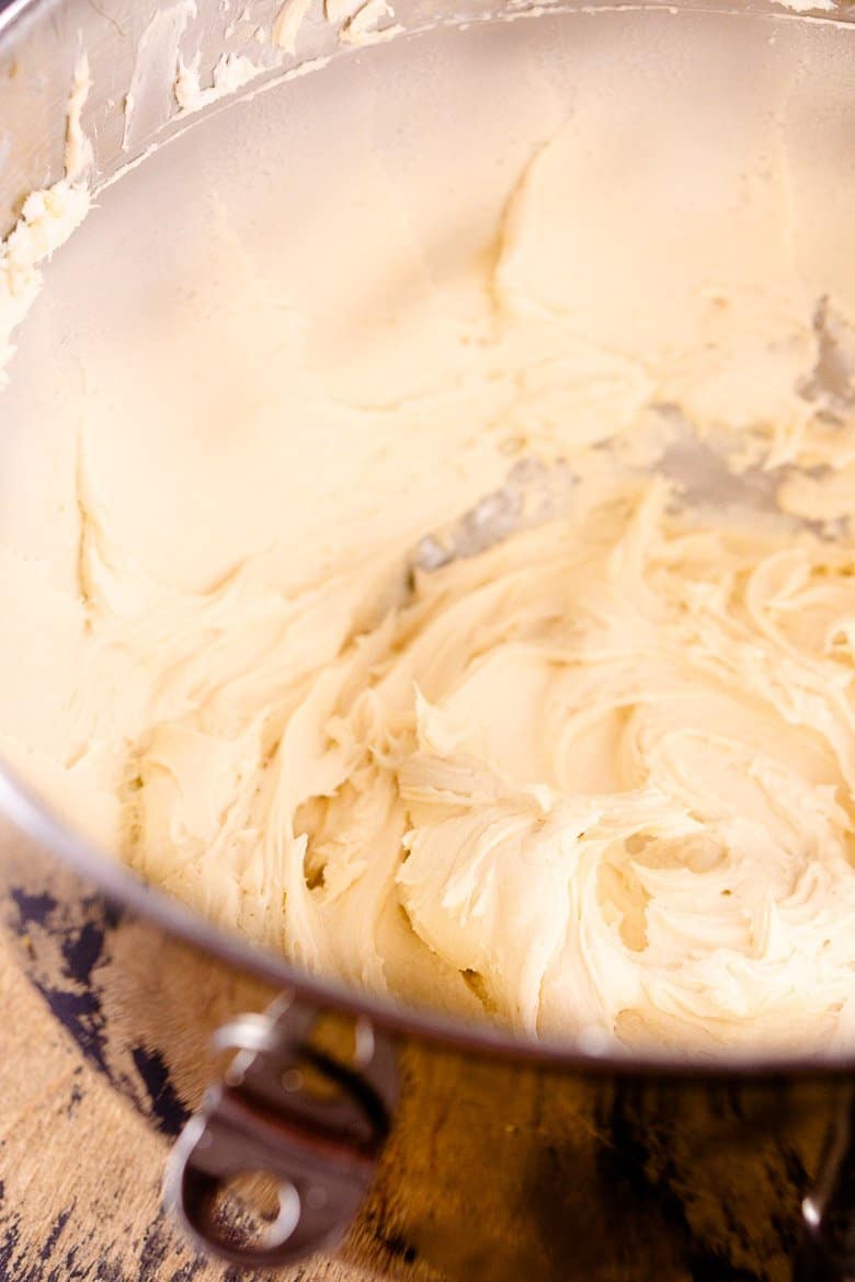 A bowl of the bourbon caramel frosting after it's been whipped to a fluffy texture.