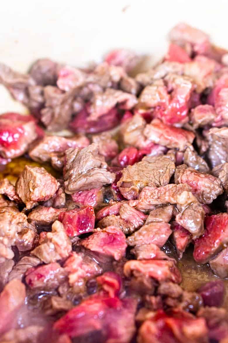 Browning the chuck roast in a large Dutch oven.