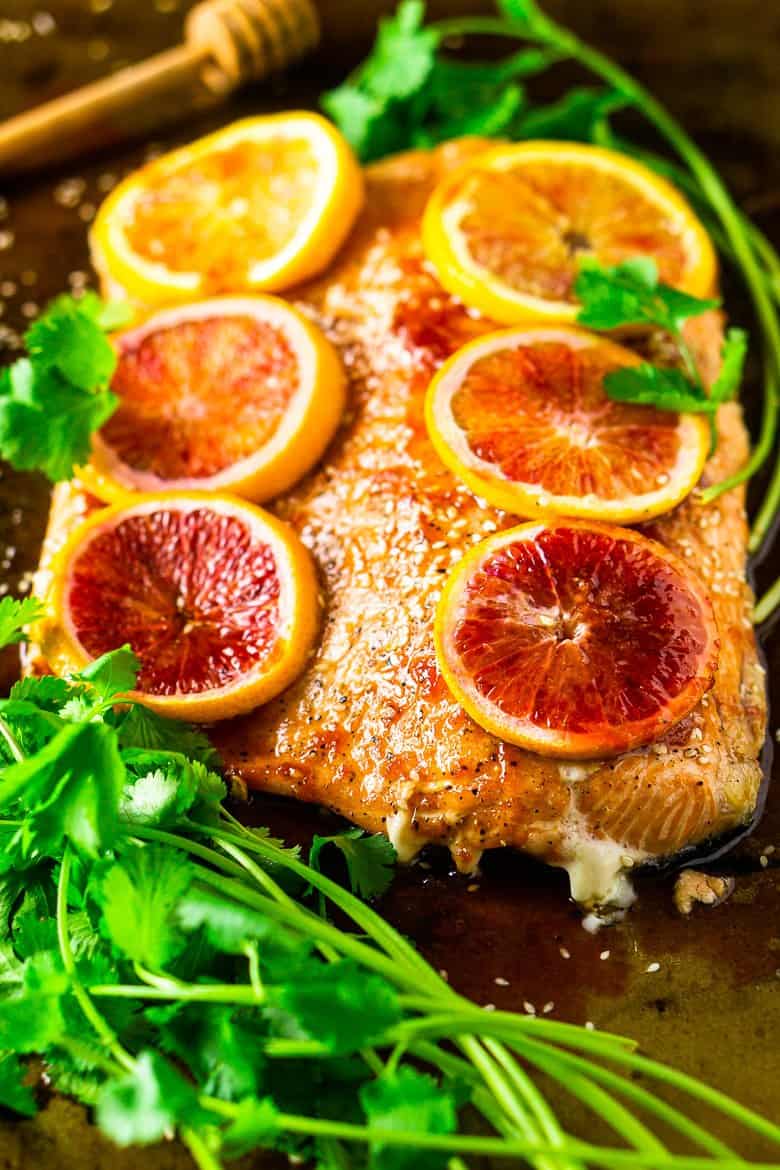 cooking straight onto the salmon with cilantro and sesame seeds around it.