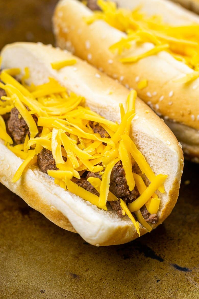 The buns filled with ground beef and cheddar before broiling.