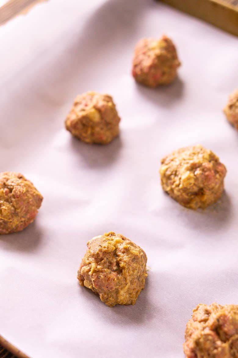 The formed meatballs onto a parchment paper-lined baking sheet.
