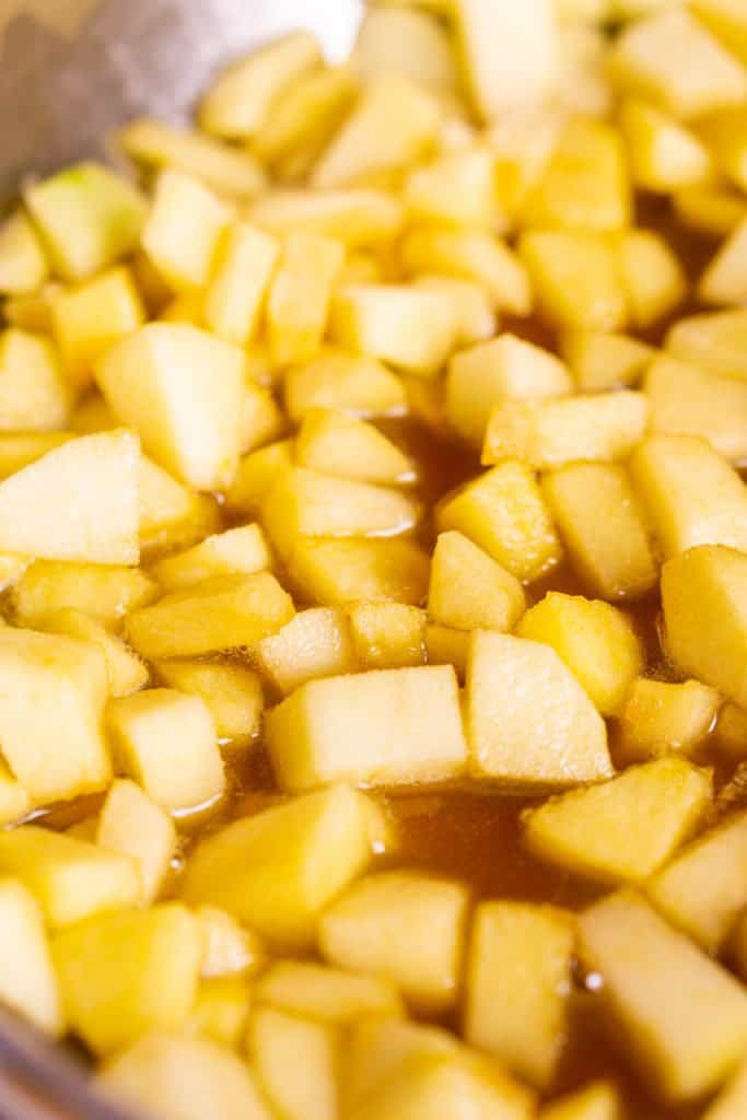 The diced apples after they've softened in a skillet with maple syrup and butter.