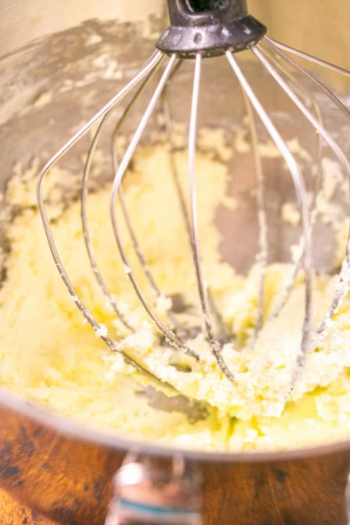 The whipped cream cheese butter in a mixing bowl after it's been whipped together.