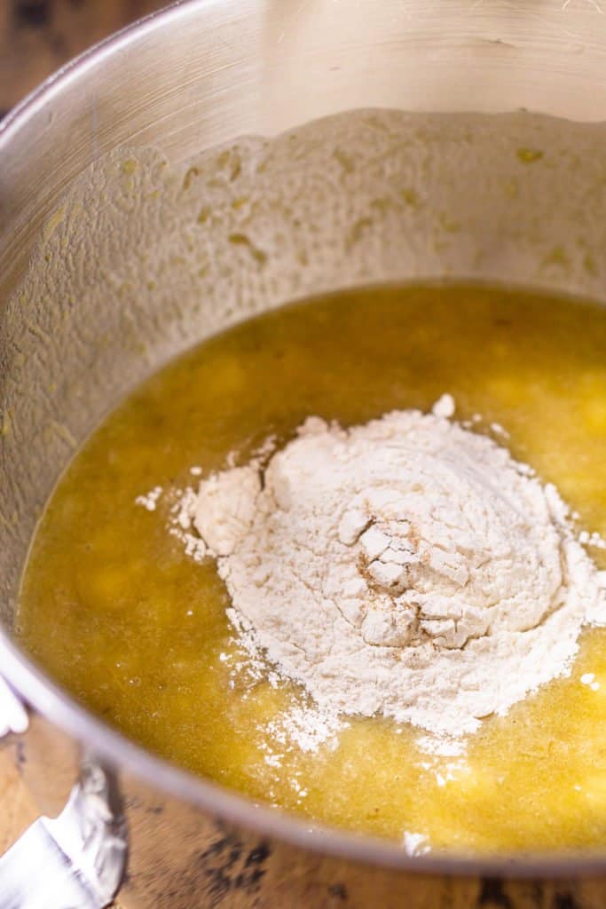 A mixing bowl after adding part of the dry ingredients to the wet ingredients.