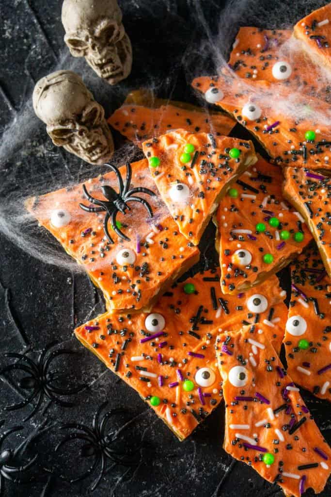 An aerial view of the Halloween toffee with spider webs and skulls on the side.