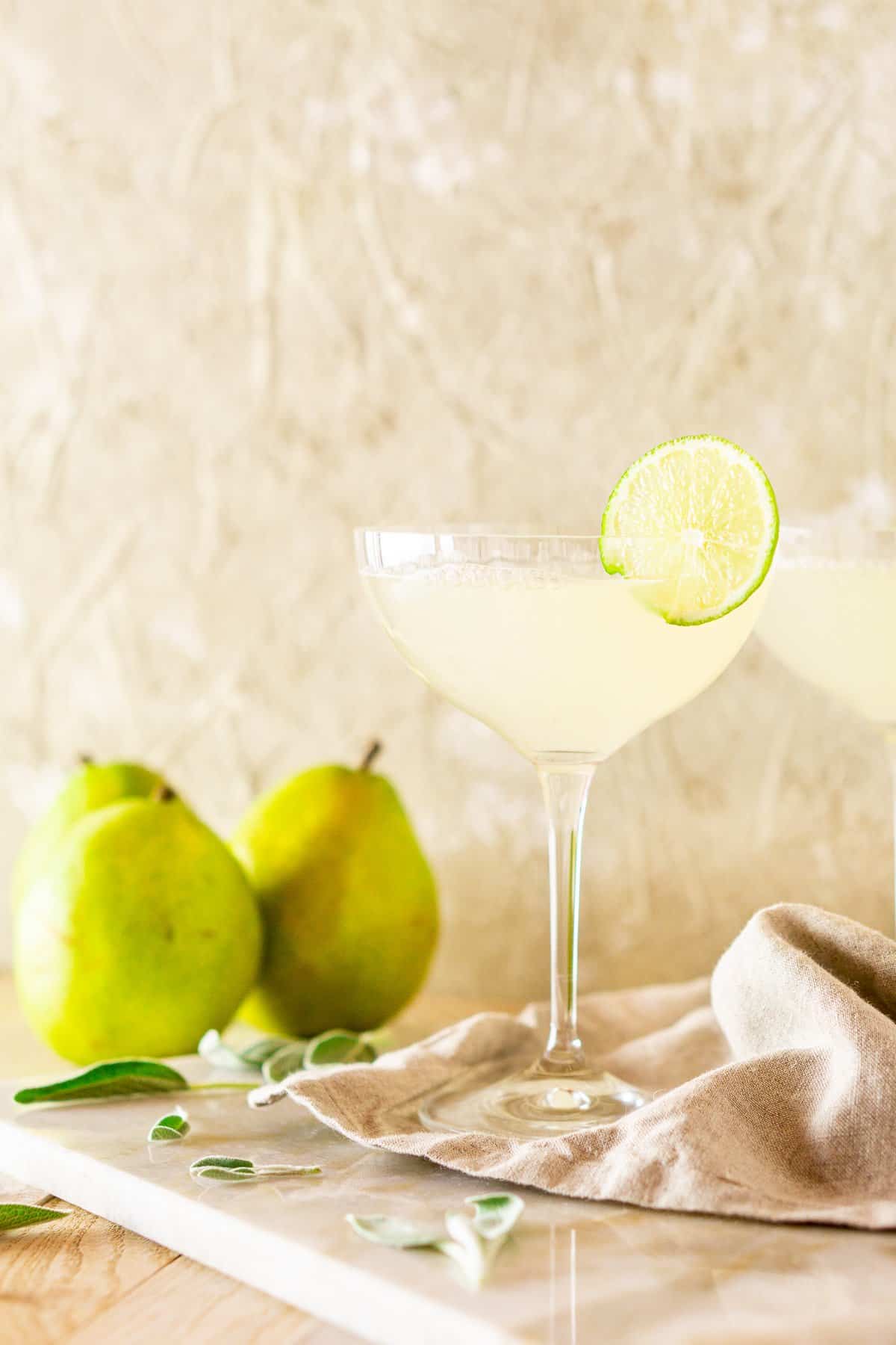 Looking straight on of the fall gimlet with pears behind it.