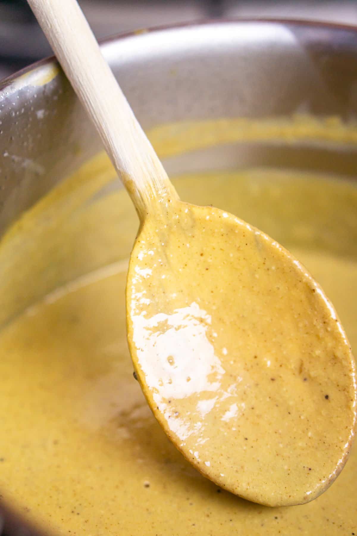 The gingerbread ice cream custard that has cooked until it's coating a wooden spoon.