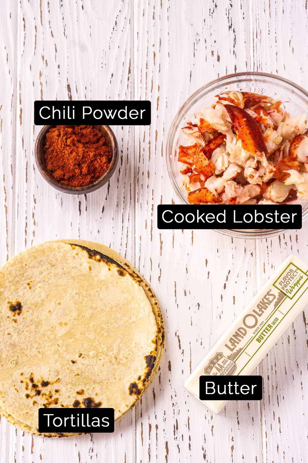 The lobster taco ingredients with black and white labels.