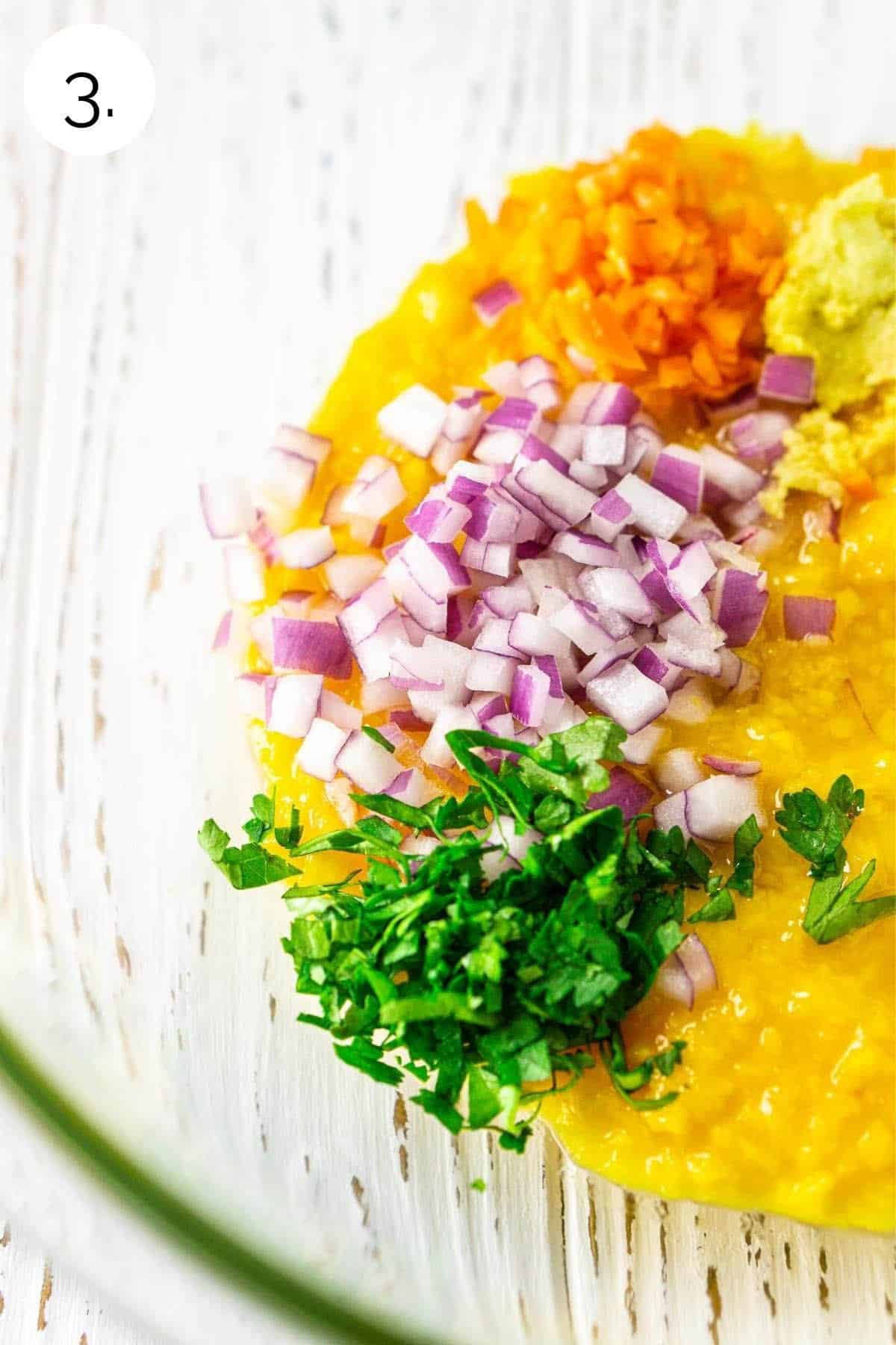 Adding the ingredients with the purée to a glass mixing bowl.