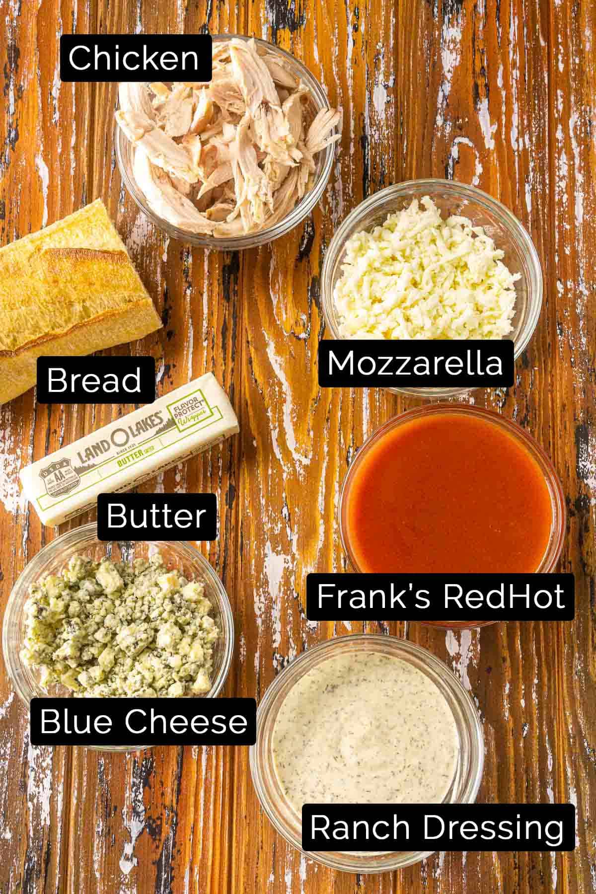 The Buffalo chicken sub ingredients with black and white labels.