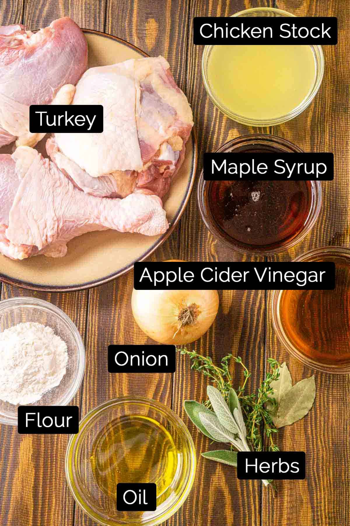 The braised turkey leg ingredients with black and white labels on a board.