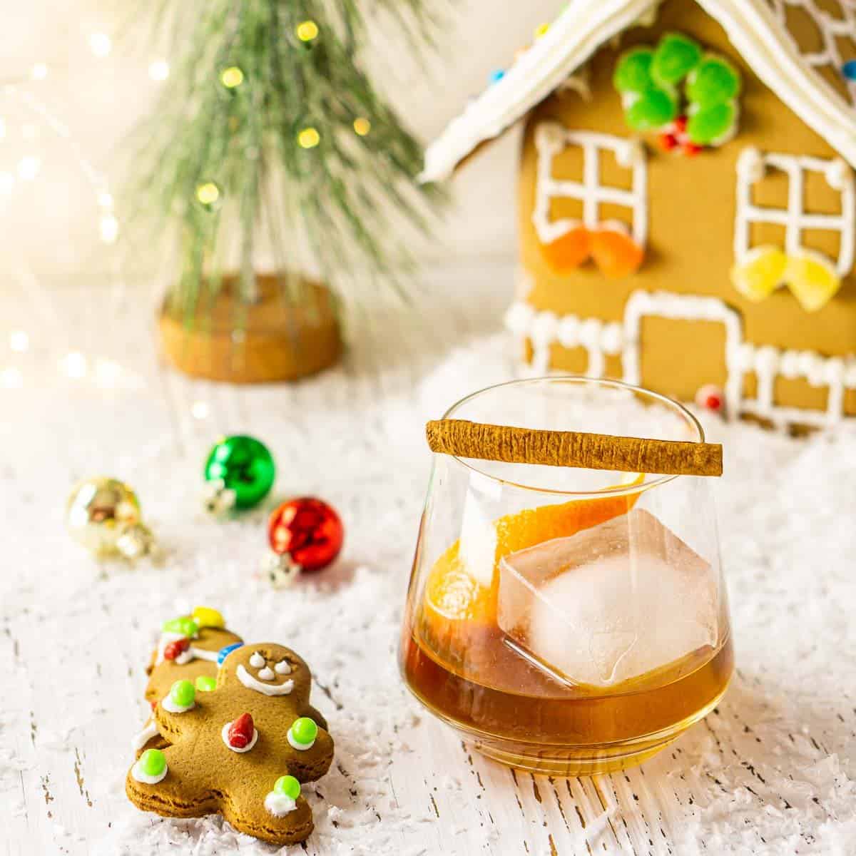 A gingerbread old fashioned with a wintry scene in the background.