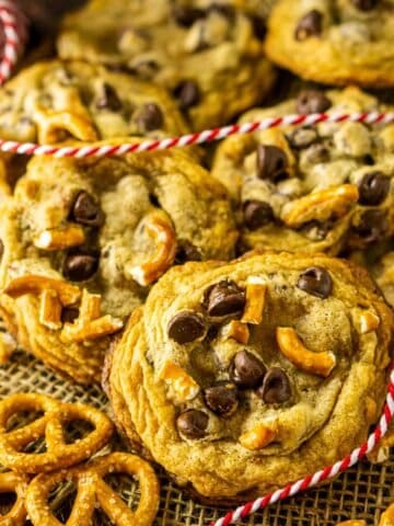 Pretzel chocolate chip cookies on a piece of burlap with red and white string.