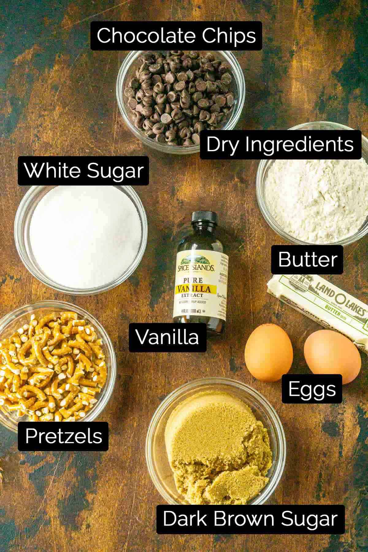 The pretzel chocolate chip ingredients on a wooden board with labels.