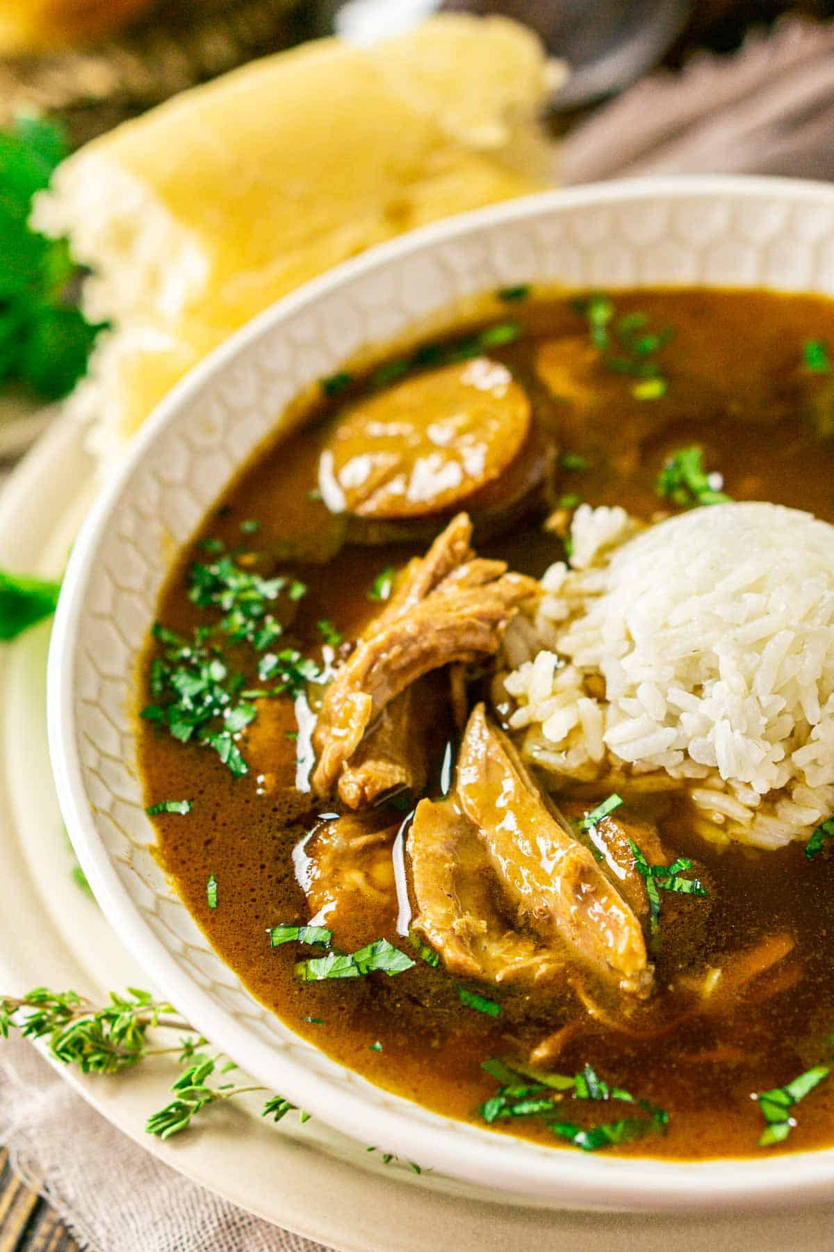 A close-up shot of the dumb gumbo with bread torn off behind it.