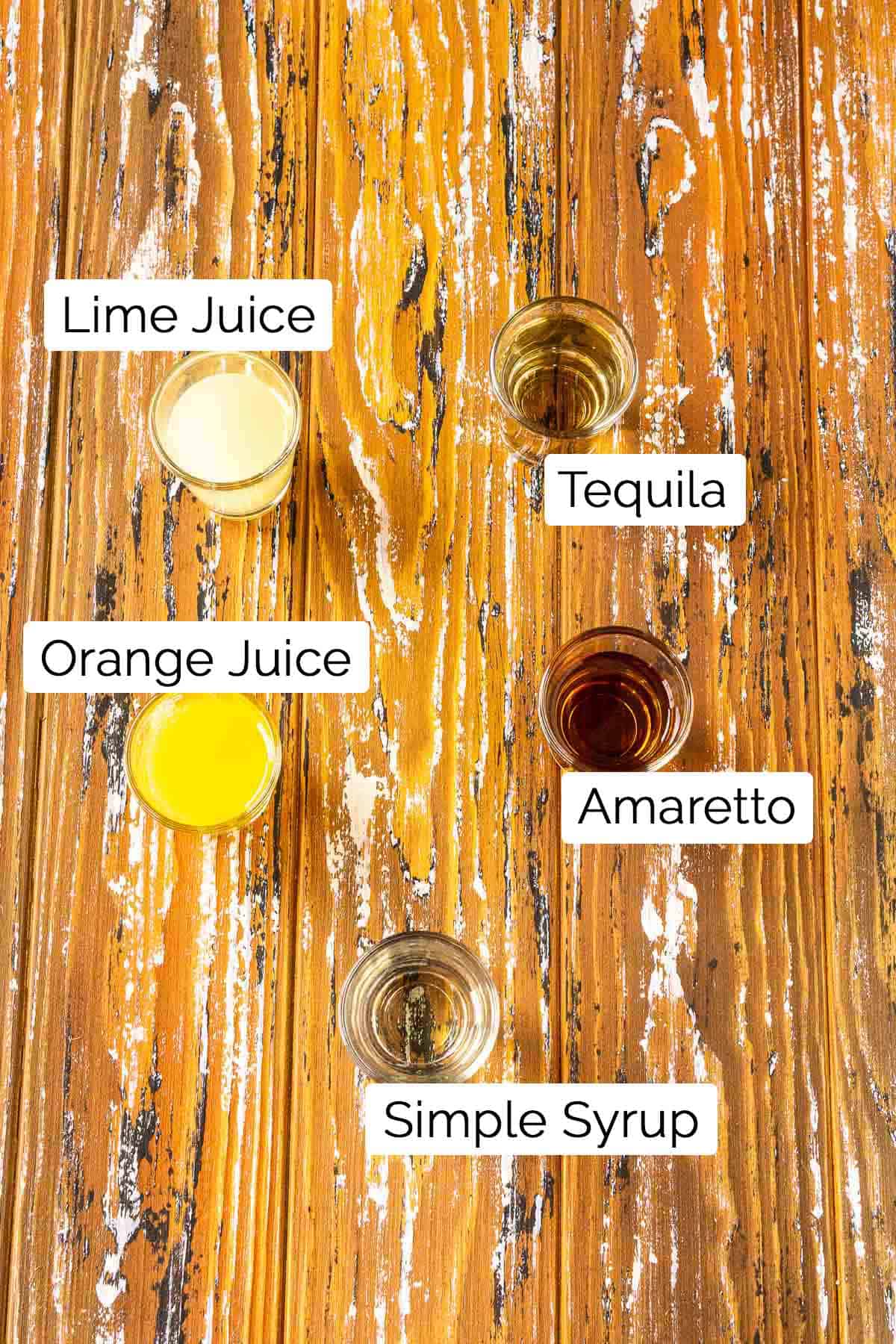 The ingredients with labels on a wooden board with white paint.