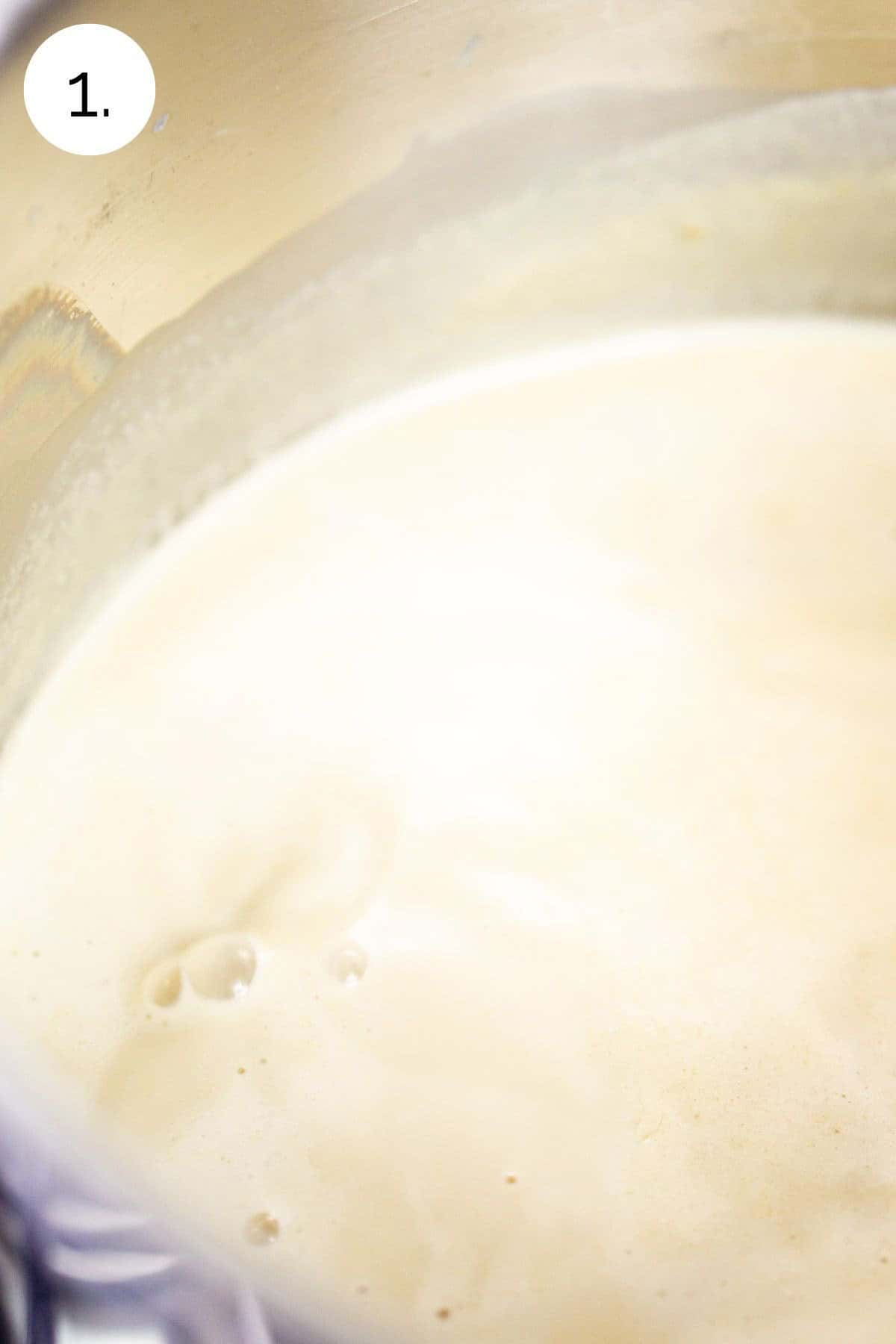 Simmering the milk, heavy cream and brown sugar in a medium saucepan on the stove.