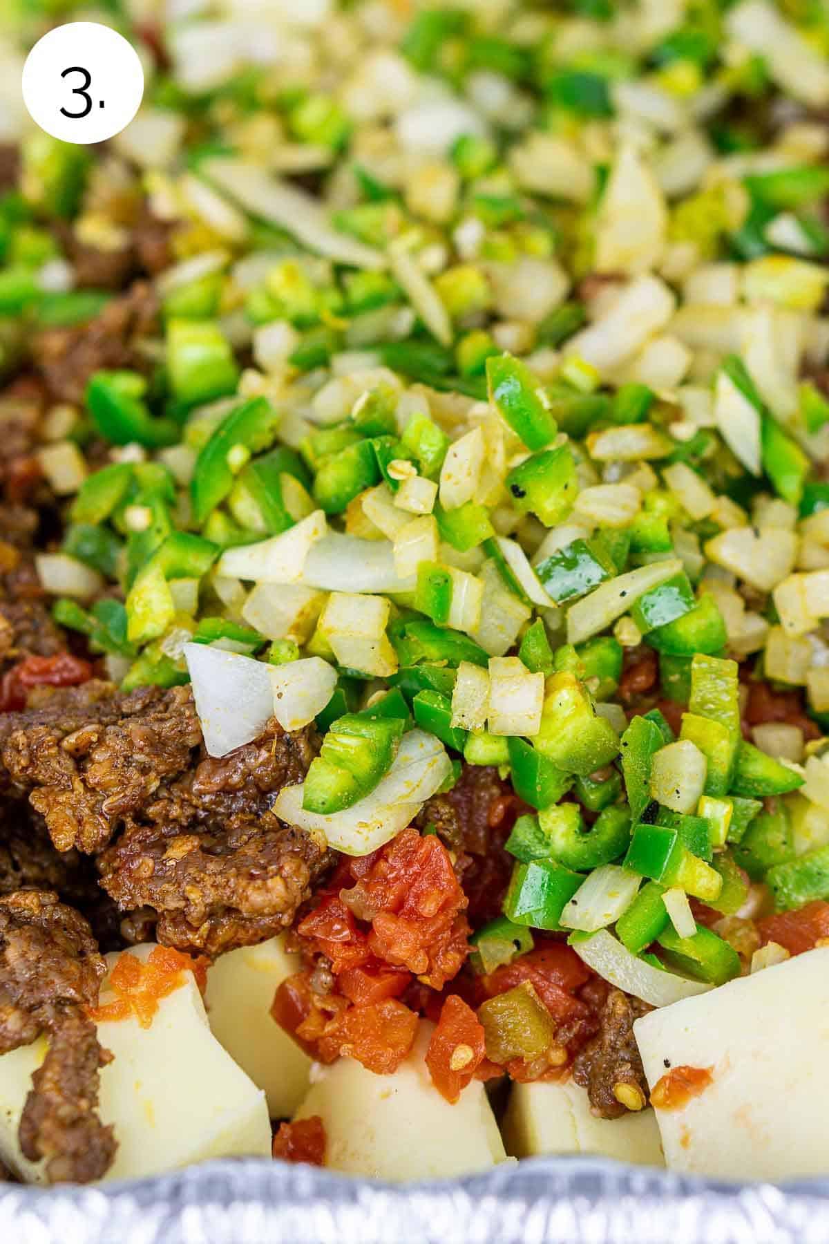 All the ingredients piled in a disposable aluminum pan before smoking.