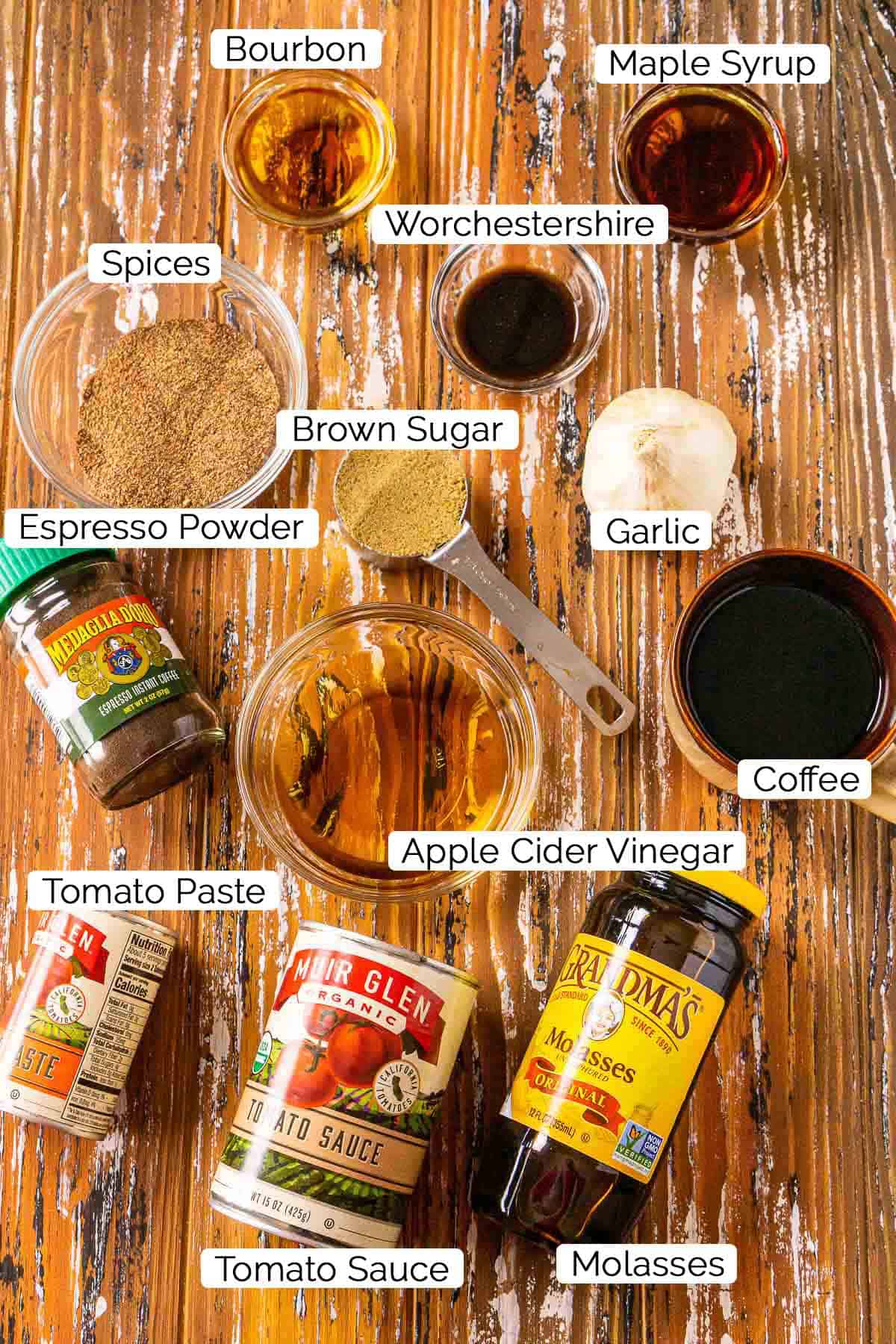 The ingredients for the sauce with black and white labels on a wooden board.
