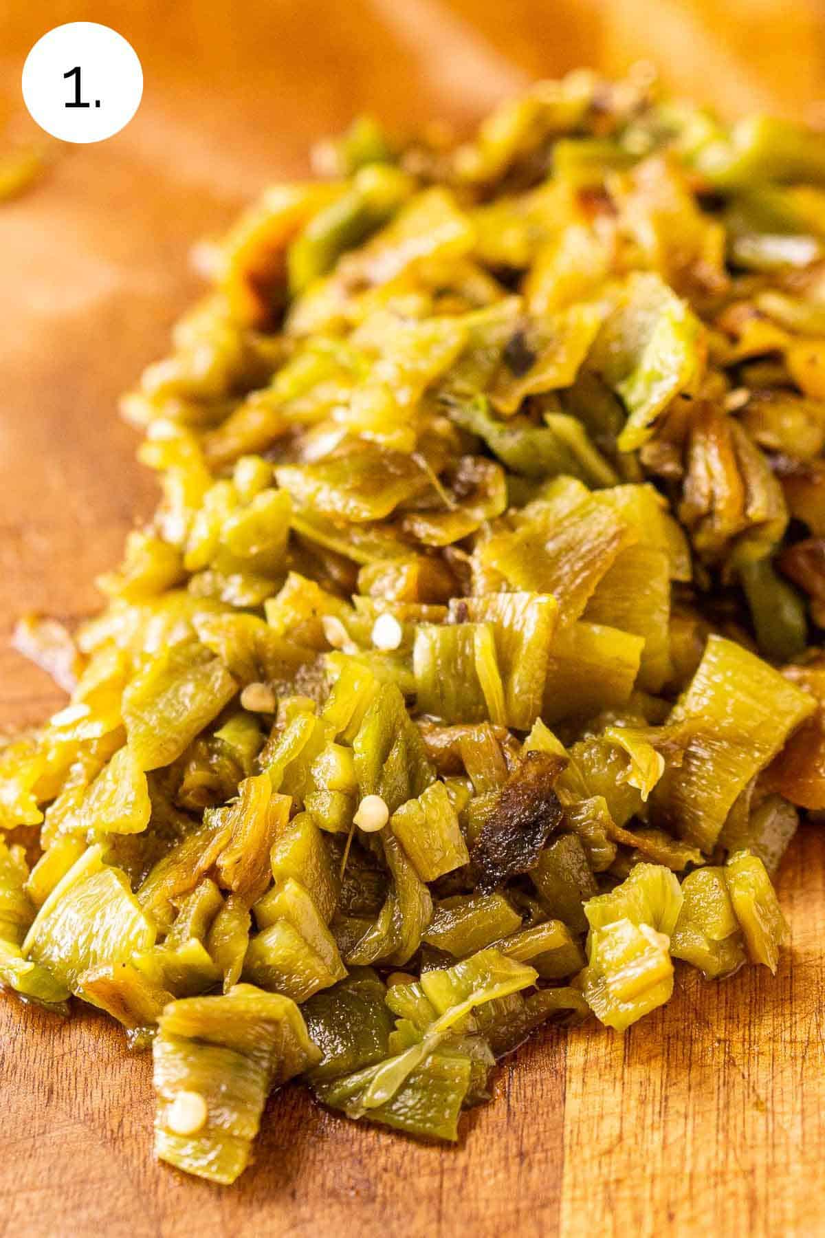 The green chiles chopped and peeled on a wooden cutting board before using in the stew.