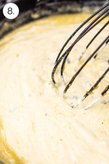 Whisking in the sour cream into the broth to make the verde sour cream sauce.