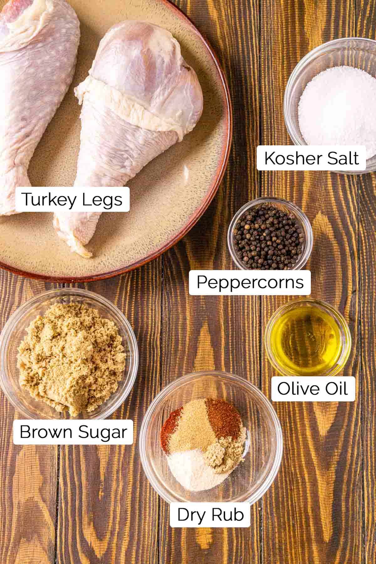 The recipe ingredients on a brown wooden photography board with black and white labels.