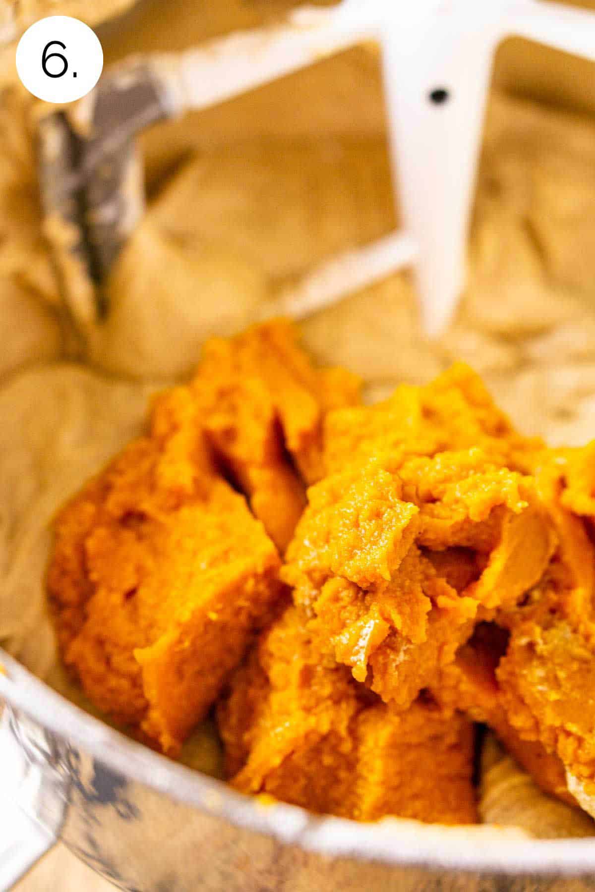 The pumpkin purée on top of the batter in a large mixing bowl before stirring together.