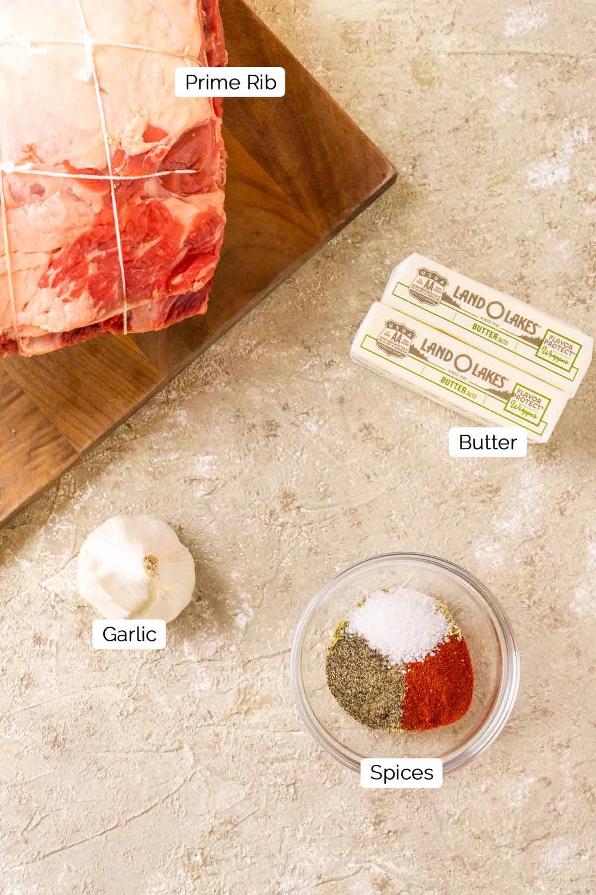 The ingredients on a cream-colored surface with black and white labels by each food item.