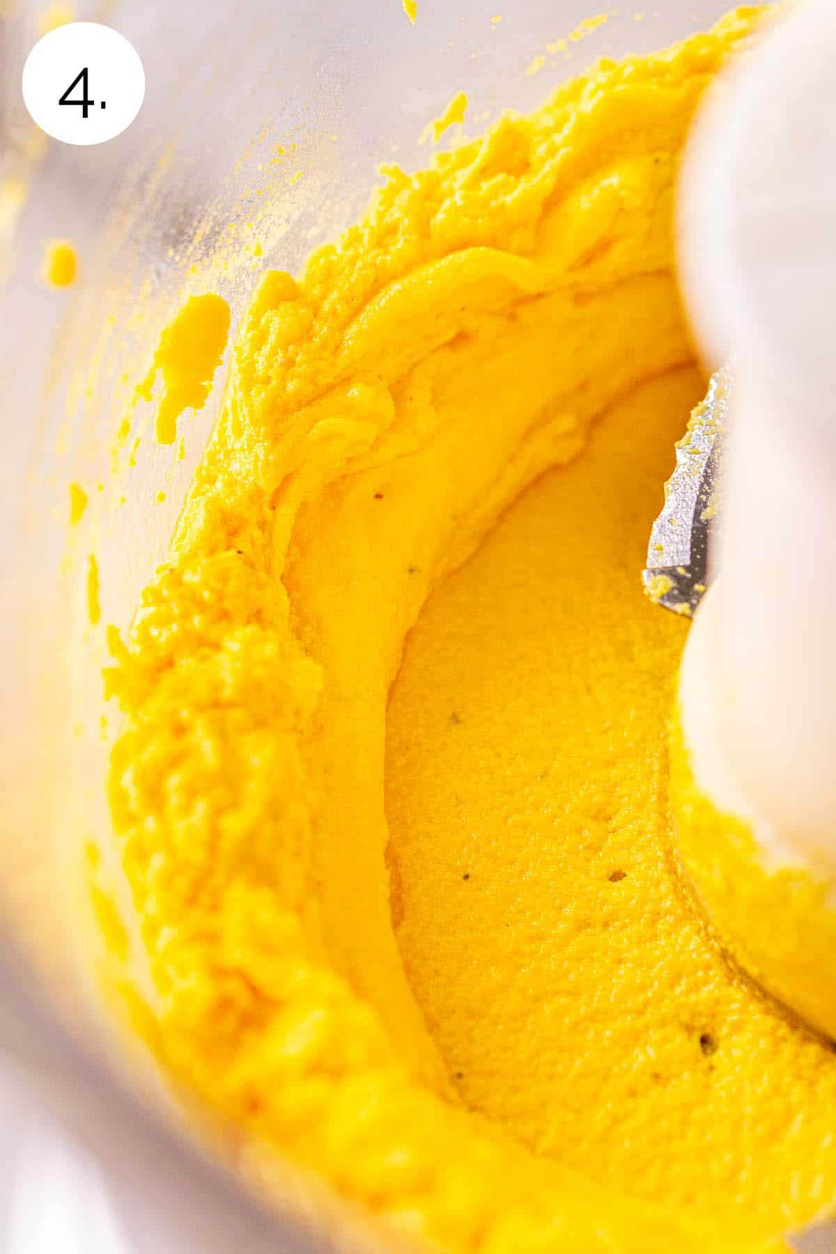 The egg yolk mixture in a food processor after they've been blended to make the filling.