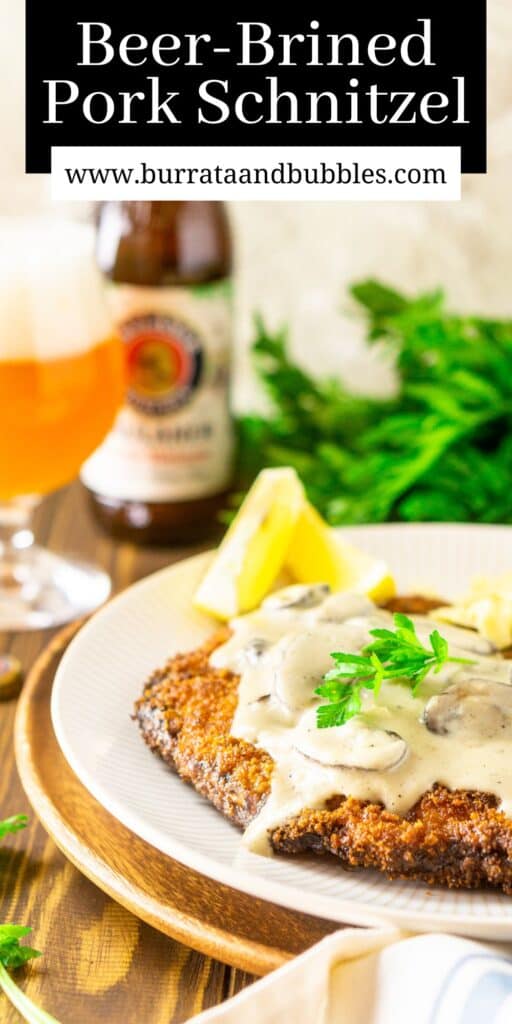 The pork schnitzel smothered with a mushroom gravy with a German beer in the background and text overlay on top of the image.