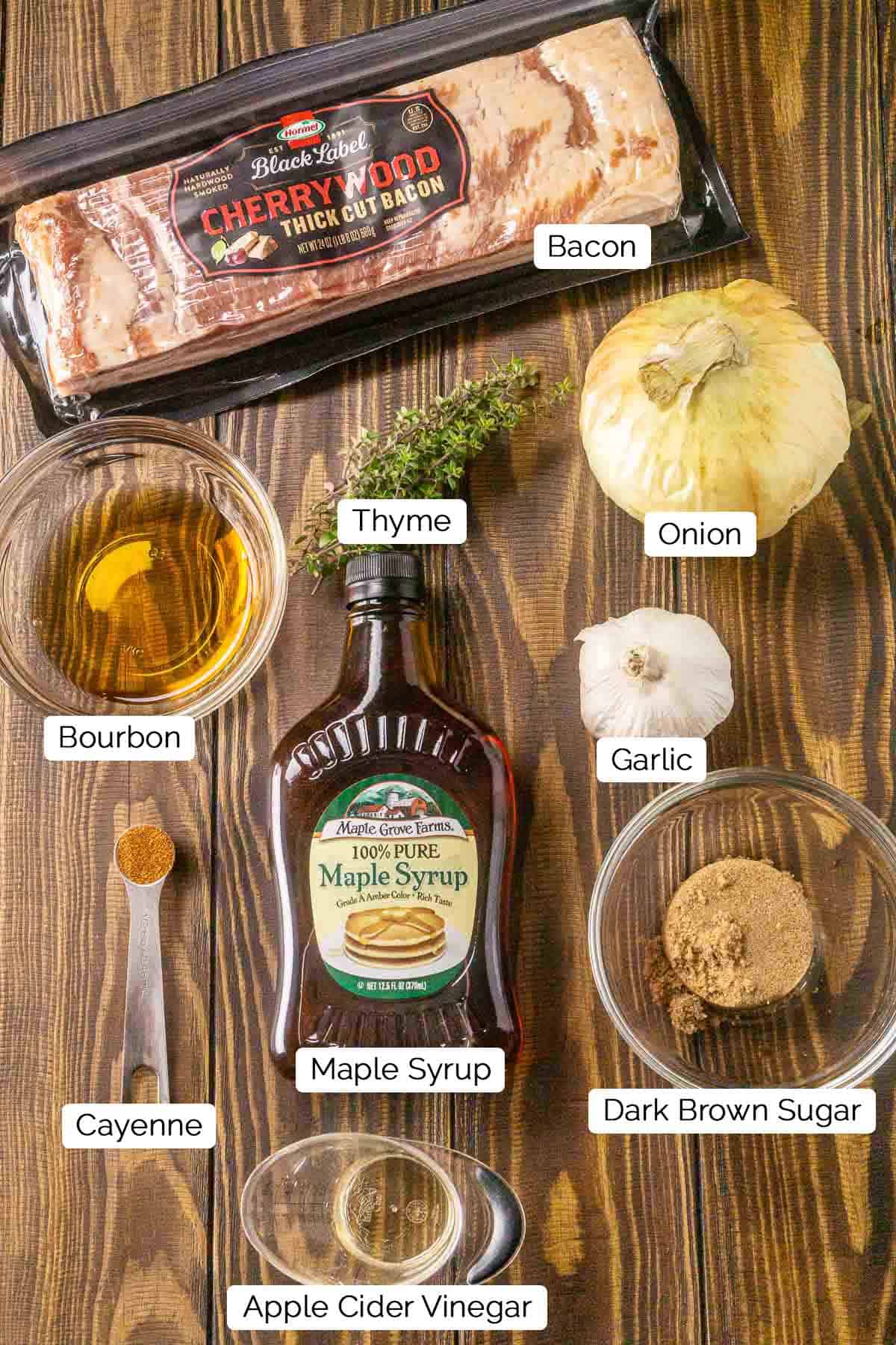 The ingredients on a brown wooden surface with black and white labels by the various items.