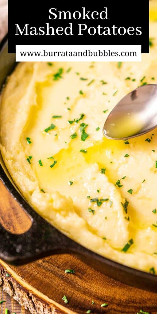 A spoon drizzling melted butter over the smoked mashed potatoes in a cast-iron skillet with text overlay on top.