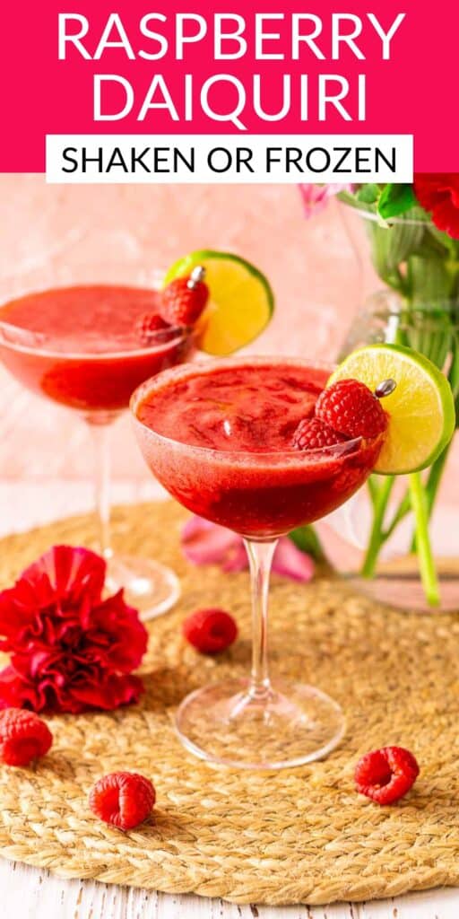 A raspberry daiquiri on a straw placemat with fresh berries and pink flowers around it with text overlay on top of the image.